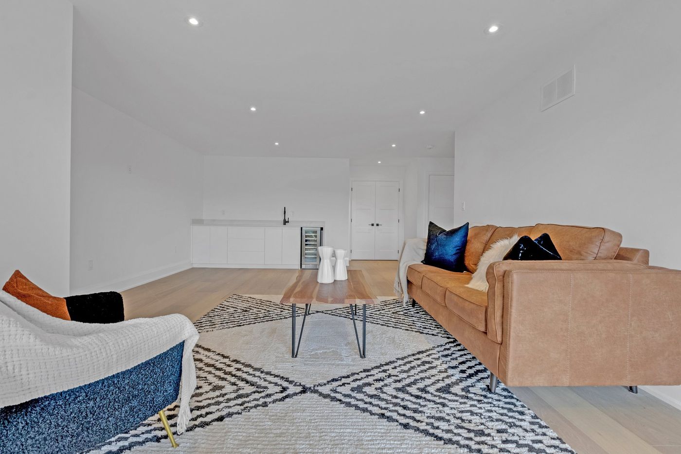 Loft family room with wet bar and beverage fridge
