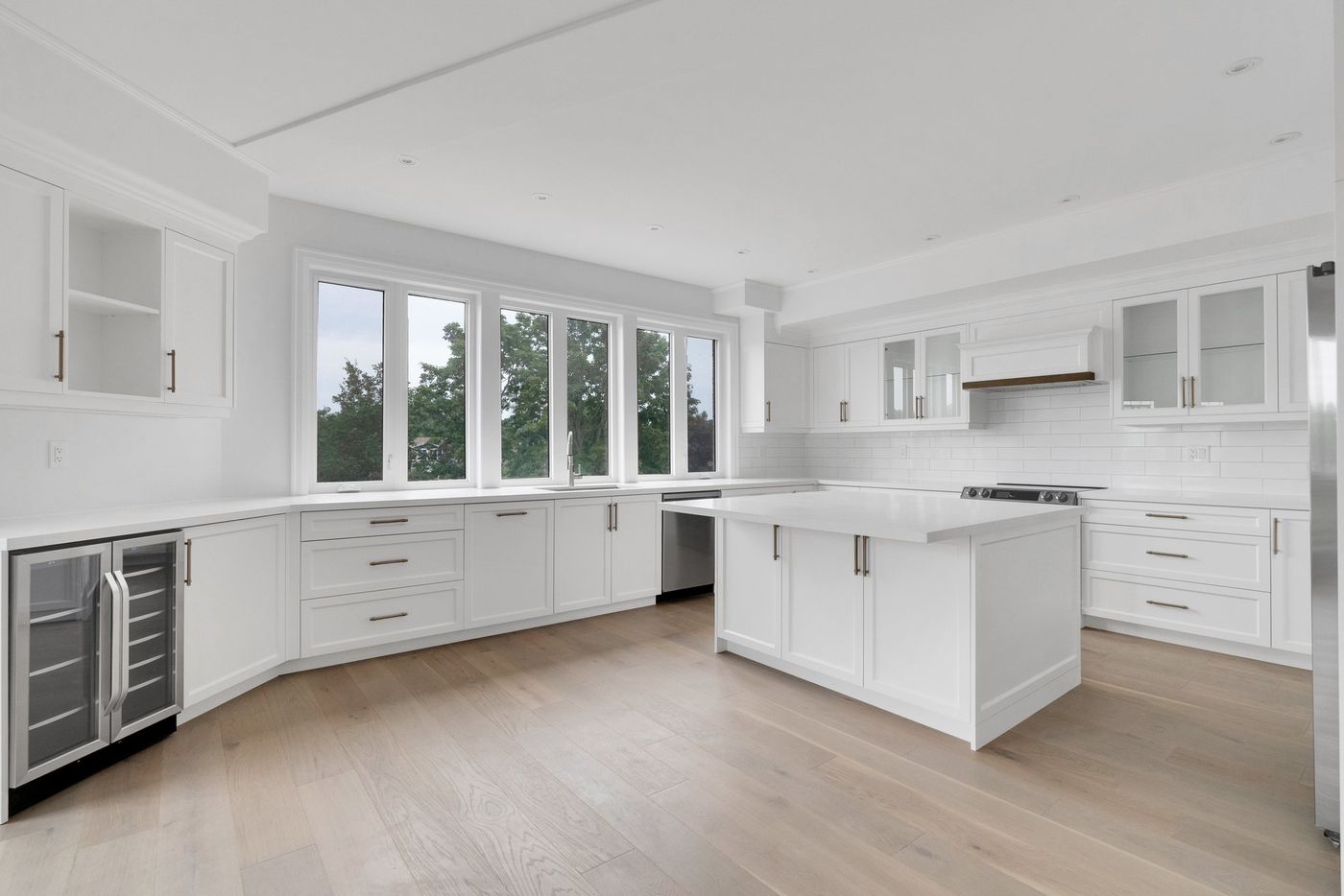 Kitchen with wine fridge and window wall